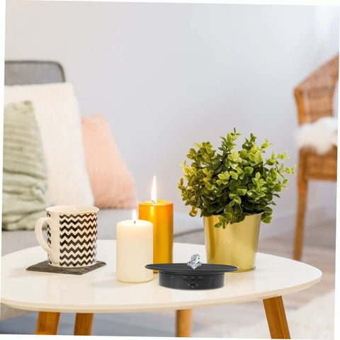 Smooth Rotating Jewelry Display Stand With Adjustable Speed Motorized Turntable For Retail Store Showcase And Product Photography Features Black Base And Convenient Usb Connectivity For Easy Power On Anywhere on a table with decor.