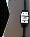 RV Surge Protector 120V 30A with LED voltage monitor and circuit tester at campground power pedestal, ensuring power safety