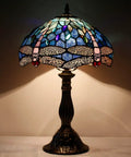 Tiffany Style Dragonfly Blue Stained Glass Table Lamp For Desk And Bedside Reading Light With Antique Green Bronze Base Delivers A Cozy Vibe And Soft Warm Glow For Living Room Bedroom Or Home Office Decor.
