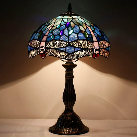Tiffany Style Dragonfly Blue Stained Glass Table Lamp For Desk And Bedside Reading Light With Antique Green Bronze Base Delivers A Cozy Vibe And Soft Warm Glow For Living Room Bedroom Or Home Office Decor.