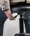 Person adjusting Swivel Garage Bar Stool With Adjustable Height For Workshop And Auto Shop Durable Mechanic Stool height handle