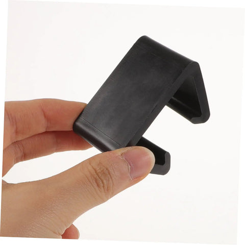Hand holding black Rattan Furniture Clips For Outdoor Sectional Sofas And Chairs No Fuss Easy Install Patio Fasteners