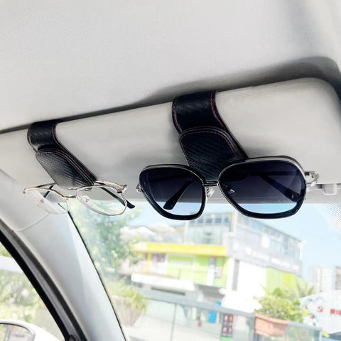 Keep Your Ride Looking Sharp With This Two Pack Magnetic Sunglass Holder Upgrading Leather Visor Clip holding glasses in car.