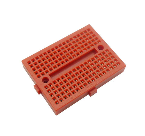 Red ABS board from Six Piece 170 Tie Points Mini Breadboard Kit With 65 Jumper Wires For Arduino And Raspberry Pi Diy Projects.