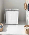 Compact Portable Washing Machine Featuring Heavy Duty Motor And Rapid Clean Cycle With Free Drying Rack Ten Sturdy Hangers in a bright laundry room.