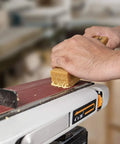 Abrasive Cleaning Stick For Sanding Belts And Discs Eight And A Half Inches Natural Rubber Eraser in use, removing residues.
