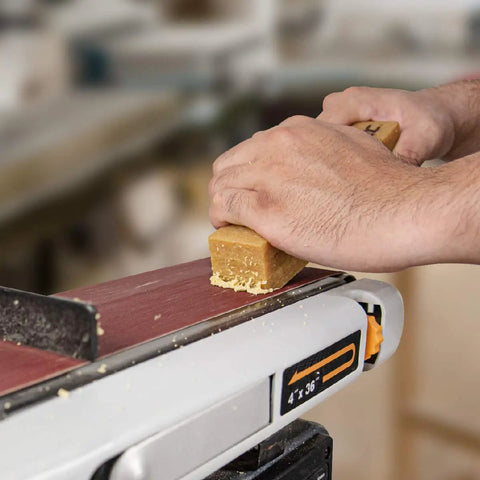 Abrasive Cleaning Stick For Sanding Belts And Discs Eight And A Half Inches Natural Rubber Eraser in use, removing residues.
