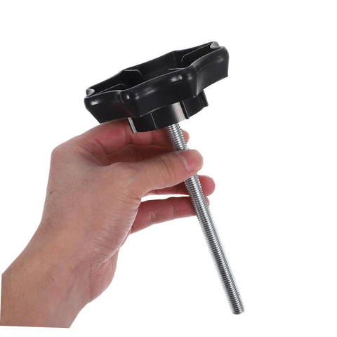 Hand holding Spare Tire Clamp Bolt For Quick Secure Mounting And Easy Installation Heavy Duty Hold Down Fastener For Cars