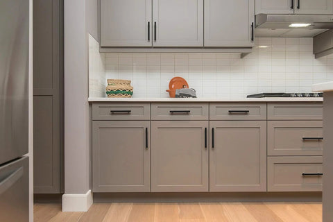 Matte Black 7.38 Inch Cabinet Pulls 30 Pack Stainless Steel Kitchen Cupboard Handles installed on modern gray cabinets.