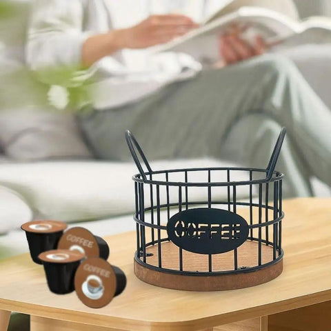 Coffee Pods Holder For Countertop With Wood Base, sturdy pod storage basket on table with K-Cups nearby, black frame, frost texture.