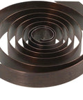 Close-up of a mainspring from 4 Pack Mechanical Clock Main Springs Replacement Kit With Alarm Clock Movements And Spare Parts