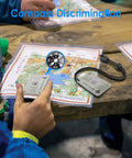 Military Grade Signal Mirror Survival Tool With Small Compass And Whistle used with map for navigation on wooden table