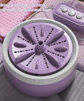 Portable Mini Washing Machine With USB Rechargeable Cordless Setup For Dorm And Travel Featuring Dual Turbine Agitator and Suction Base, purple design.