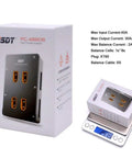 Dope 1-8S LiPo Battery Parallel Charge Board With XT60 Safe Four Channel Balance Plate on box and scale showing weight