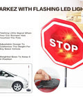 Park Like A Boss Smart LED Reversible Garage Stop Sign With Heavy Duty Base And Flashing Warning Signal in parking area.