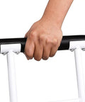 Hand gripping handle of FSA HSA Eligible Sit And Rise Bathroom Safety Frame With Height Adjustable Toilet Rail And Commode Grab Bar.