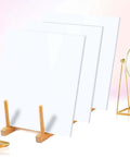 Three white acrylic sheets, 8x8 inches and 3 mm thick, displayed on wooden stands.
