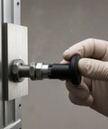 Heavy Duty Self Locking Indexing Pin With Pull Knob And Threaded Shaft Nails Your Setup Every Time And Stays Locked Down Tight So You Can Cruise Through Assembly Tasks Smooth, being operated with a gloved hand.