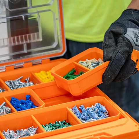 Worker holding orange MODBOX Replacement Bins Four Pack Rectangle and Square Bins for Short Component Boxes with screws inside