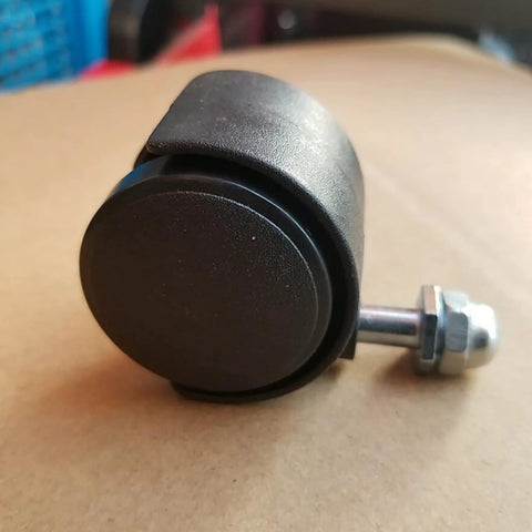 Close-up of a black universal heater caster wheel with metal mounting bolt and nut
