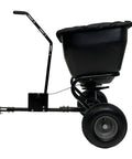 Side view of Deluxe Tow Behind Broadcast Spreader with Extended Easy Reach Handle and Weatherproof Cover, 175 lb capacity.