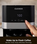 10 Cup Drip Coffee Maker With 24 Hour Programmable Timer displayed with digital clock and user pressing a button
