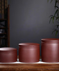 Heavy Hitter Ceramic Rice Jar Round With No Sweat Seal, Retro Large Capacity Airtight Grain Bucket, Real Deal Pantry Storage For Tea Coffee Beans And Snack Stash, High Fire Kiln Made, three jars on a wooden surface.