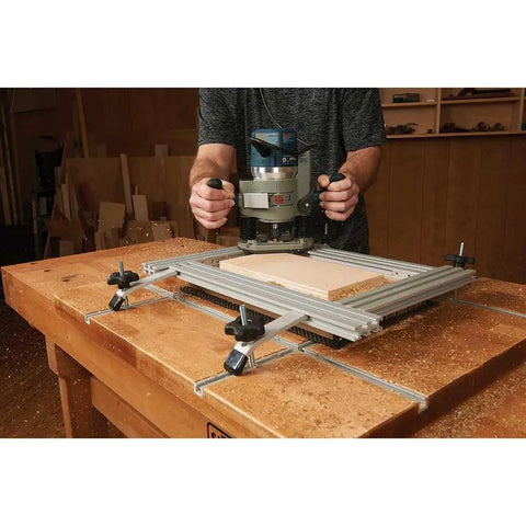 Heavy Duty Variable Router Jig For Cutting Clean Rectangular Recesses And Slots With Rock Solid Anodized Aluminum Frame Plus Quick Adjust Stops in use, cutting wood.