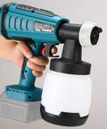 Person holding a Cordless HVLP Paint Sprayer Kit With 18V Battery Compatibility, visible spray gun and paint container