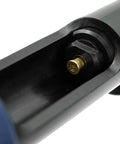 Close-up of Brown Neck Down 22 Cal Single Shot Powder Load in tool chamber, for powder actuated fastening system.