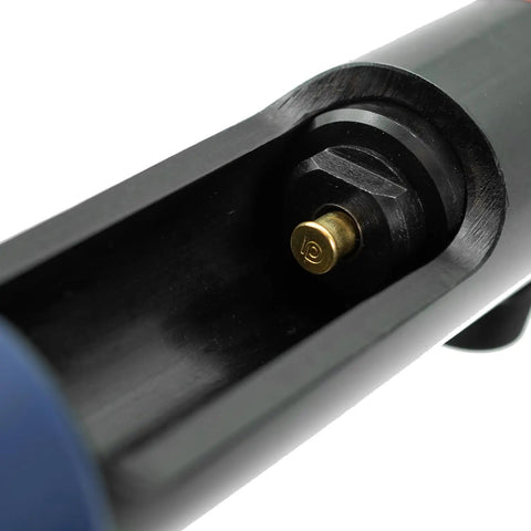 Close-up of Brown Neck Down 22 Cal Single Shot Powder Load in tool chamber, for powder actuated fastening system.