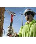 Absolute Beast Heavy Duty 4In1 Lineman Hammer 36 Oz Strike Built Different For Electricians And Job Site Pros Tough As Nails With Grippy Handle in use outdoors.