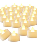 100 Pack Flameless LED Tea Light Candles Bulk With Long Lasting Battery For Safe Realistic Flicker Ambience At Weddings Parties And Home Decor Projects, arranged in a group, showing warm white flicker.