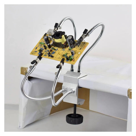 Four Arm Third Hand Soldering Station With Adjustable Gooseneck Arms holding a PCB for repair, aluminum base, black welding stand.