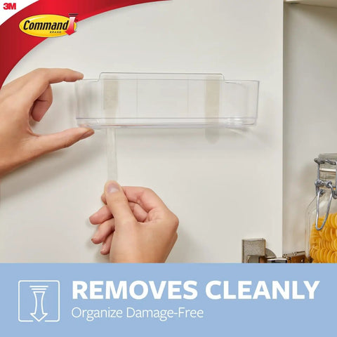 Person mounting Large Caddy Organizer With Four Strips For Under Sink And Kitchen Cabinets Holds Up To Four Pounds Damage Free Mount