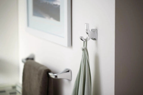 Voss Slick Brushed Nickel 24-Inch Towel Bar Wall Mounted For Bathroom Upgrade near a towel and artwork