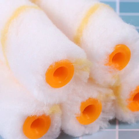Thirty Piece Mini Paint Roller Sleeves With High Density Foam To Banish Ugly Track Lines And Deliver A Smooth As Silk Wall Finish While Providing Quick Dry Coverage That Always Hits The Spot Without Breaking The Bank, featuring rounded orange ends.