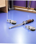 Stainless Steel Sailing Pulley Block Set Four Pack With Bearing Wheels for boat anchor and rope on a workbench.