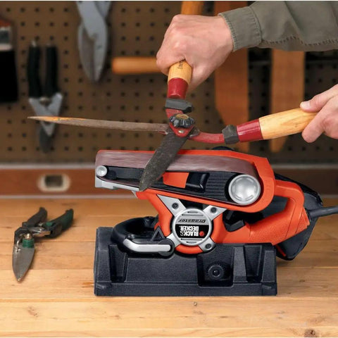 Heavy Duty Belt Sander With Dust Bag 7 Amp Motor 3 Inch By 21 Inch Angled Sanding Belt for edge sanding, shown in use on workbench.