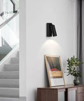 JGSYD Bedside Reading Lamp, Adjustable Metal Wall Light, Black Wall Sconce, mounted on white wall above wood cabinet.
