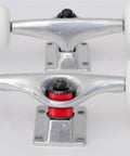 Close-up of skateboard trucks with red Skateboard Bushing Rebuild Kit, 2 Set 90A PU Longboard Truck Bushings for Dope Turns inserted