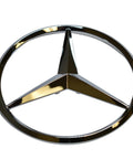 Mercedes-Benz Rear Hatch Emblem Genuine OEM 1648170016 silver replacement for your ride, round badge in polished chrome, for sedans and SUVs.
