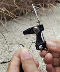 Two Pack Downrigger Release Clips With Ball Bearing Swivel For Outriggers And Kite Rigs, Smooth Line Release Arm, Precise Tension Adjuster, Durable Silver Finish, Great For Offshore Trolling Gear, black metal clip held in hand