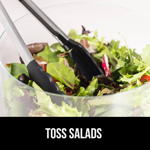 Heavy Duty Stainless Steel Kitchen Tongs Set Of 2 With Heat Resistant Silicone Tips tossing salad in a bowl