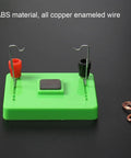 Electric Motor Model And Electromagnetic Swing Kit For Classroom Learning on black table, green ABS base with copper wire