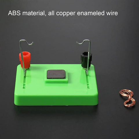 Electric Motor Model And Electromagnetic Swing Kit For Classroom Learning on black table, green ABS base with copper wire