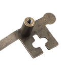 Close-up of a key shape cabinet pull handle in zinc alloy with bronze finish, threaded screw hole visible, 13.4 x 5.4 cm