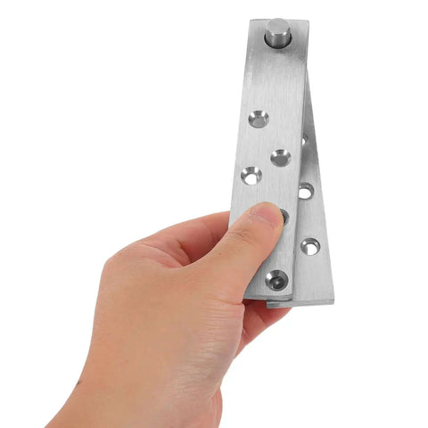 Hand holding heavy duty concealed door hinge in stainless steel, showcasing 360 degree pivot hinge for secret doors cabinets and bookcases