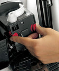 Hand adjusting the grinder mechanism of the All In One Bean To Cup Coffee Maker With Built In Grinder 15 Bar Pressure Auto Espresso Machine