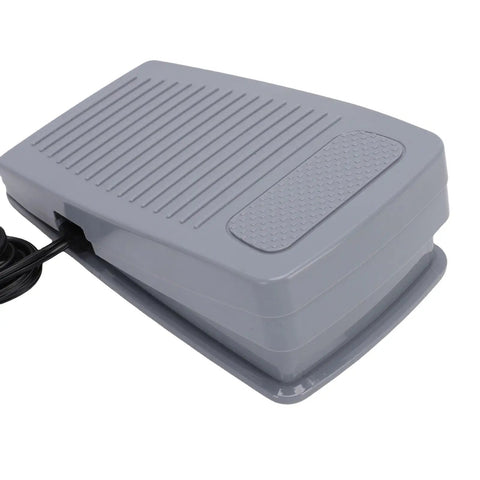 Top Shelf Foot Controller Pedal For Home Sewing Machines With Attached Cord Dead Even Speed Control Compatible With Eversewn Singer Huskystar Models Ironclad Replacement Piece, gray foot pedal from a side angle.
